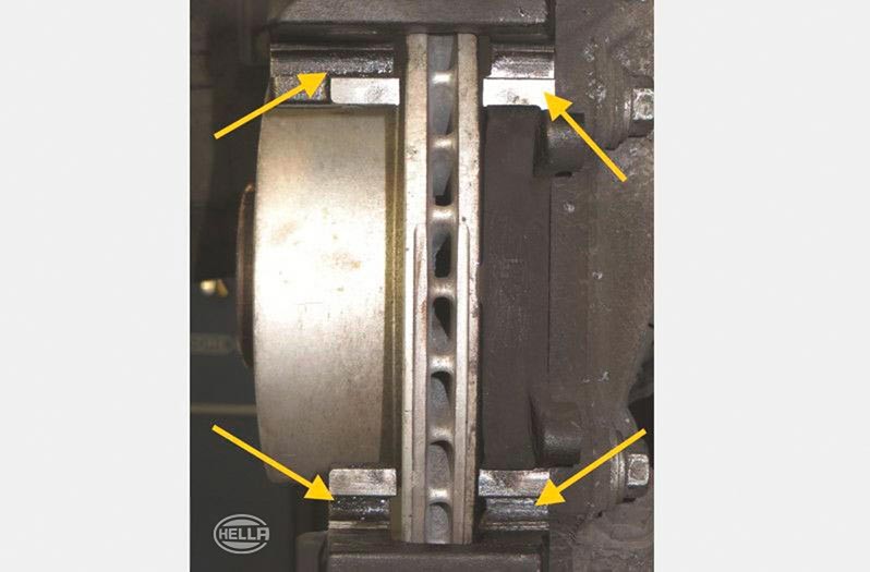 Changing brake discs, brake pads, and brake calipers: Installing the caliper anchor bracket