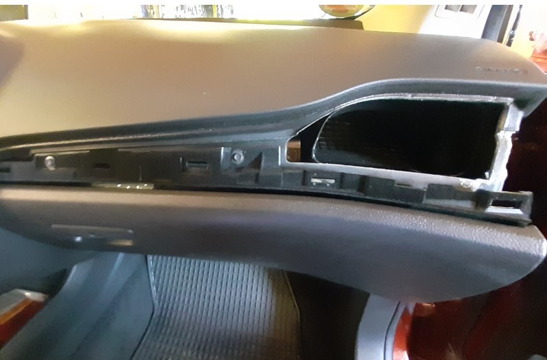 Ford Mondeo BA7 passenger-side dashboard with plastic panel removed and glove box screws exposed