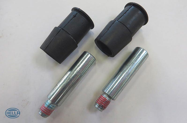 Guide bolts with damping sleeves